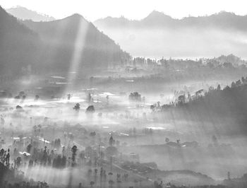 Scenic view of mountains during foggy weather