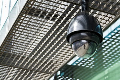 Low angle view of security camera on ceiling outdoors