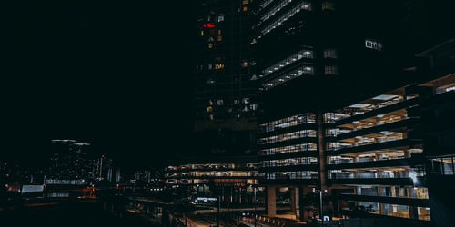 Illuminated buildings in city at night