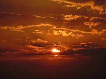 Scenic view of dramatic sky during sunset