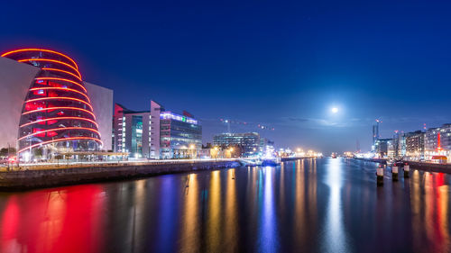 Illuminated buildings in city at night