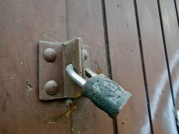 Close-up of padlock on metal door