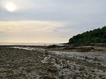 Scenic view of beach against sky during sunset