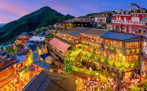 High angle view of illuminated buildings in city