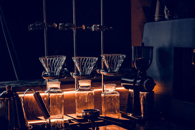 Close-up of wine glasses on table