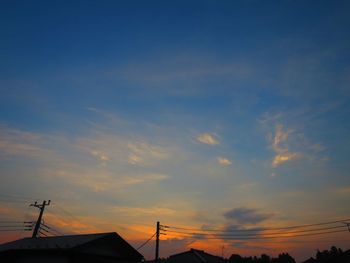 Low angle view of silhouette building against sky during sunset