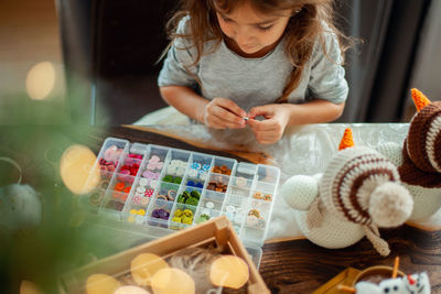 High angle view of girl holding table