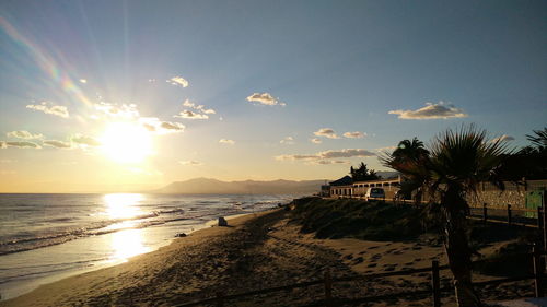 Scenic view of beach against sky during sunset