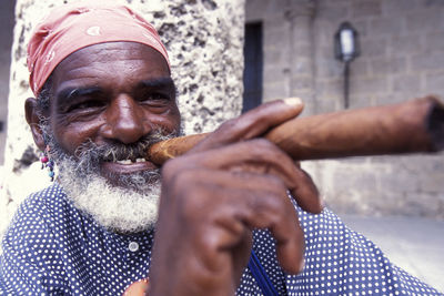 Portrait of smiling man with arms raised