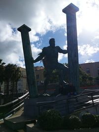 Low angle view of statue against sky