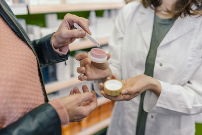 Customer testing cosmetics in pharmacy