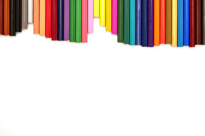 Multi colored flags against white background