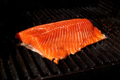 High angle view of fish on barbecue grill