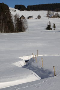 Scenic view of frozen landscape against sky