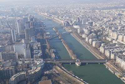 High angle view of river amidst buildings in city