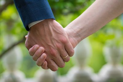 Close-up of man holding hands