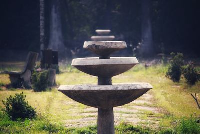 Close-up of cross on field in garden