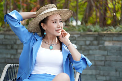 Portrait of young woman looking away