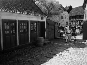 Man standing in front of built structure