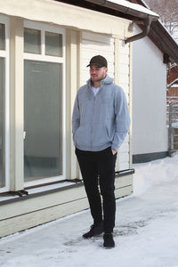 Full length of man standing in building during winter