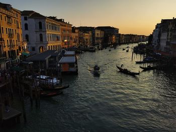 Boats in canal in city