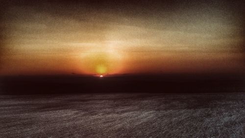 Scenic view of landscape at sunset