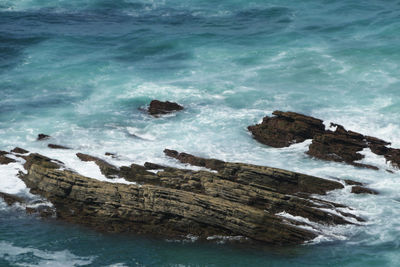 High angle view of rocks in sea