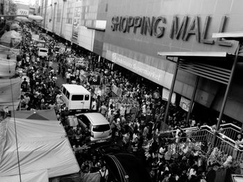 Panoramic view of people on car in city