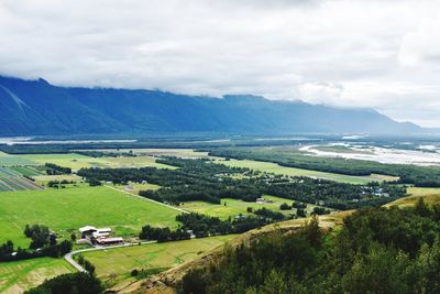 Scenic view of agricultural landscape against sky