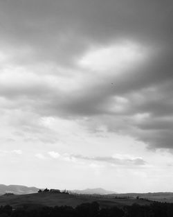 Scenic view of landscape against cloudy sky