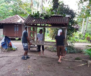 Full length of man standing by tree