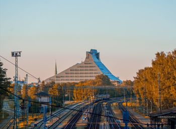 Train on bridge against clear sky