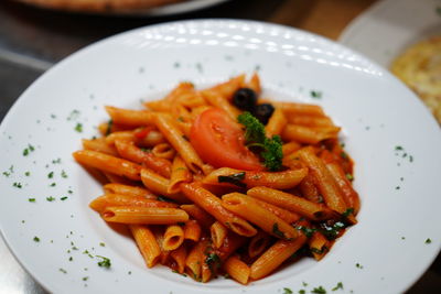 Close-up of noodles served in plate on table