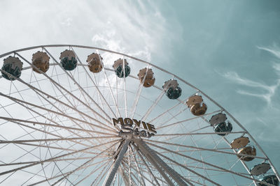 Low angle view of ferris wheel against sky