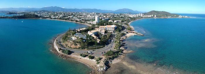 High angle view of sea and buildings against sky