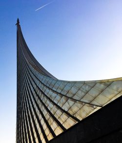 Low angle view of modern building against blue sky