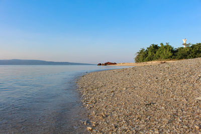 Scenic view of sea against clear sky