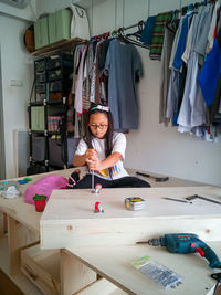 Girl repairing table