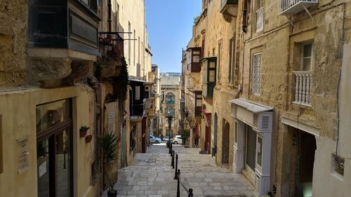 Narrow street amidst buildings in town