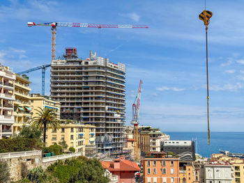Buildings in city against sky