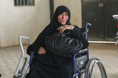 Senior woman sitting on wheelchair