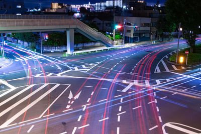 High angle view of light trails on road at night