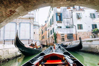 View of boats moored in canal