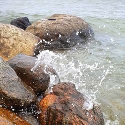 Waves splashing on rocks