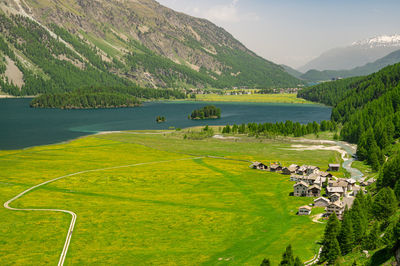 Upper engadine, lake sils, and the village of isola, photographed from above in summer.