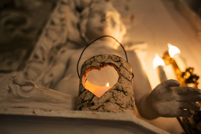 Low angle view of candles burning in temple