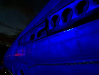 Low angle view of illuminated lights at night