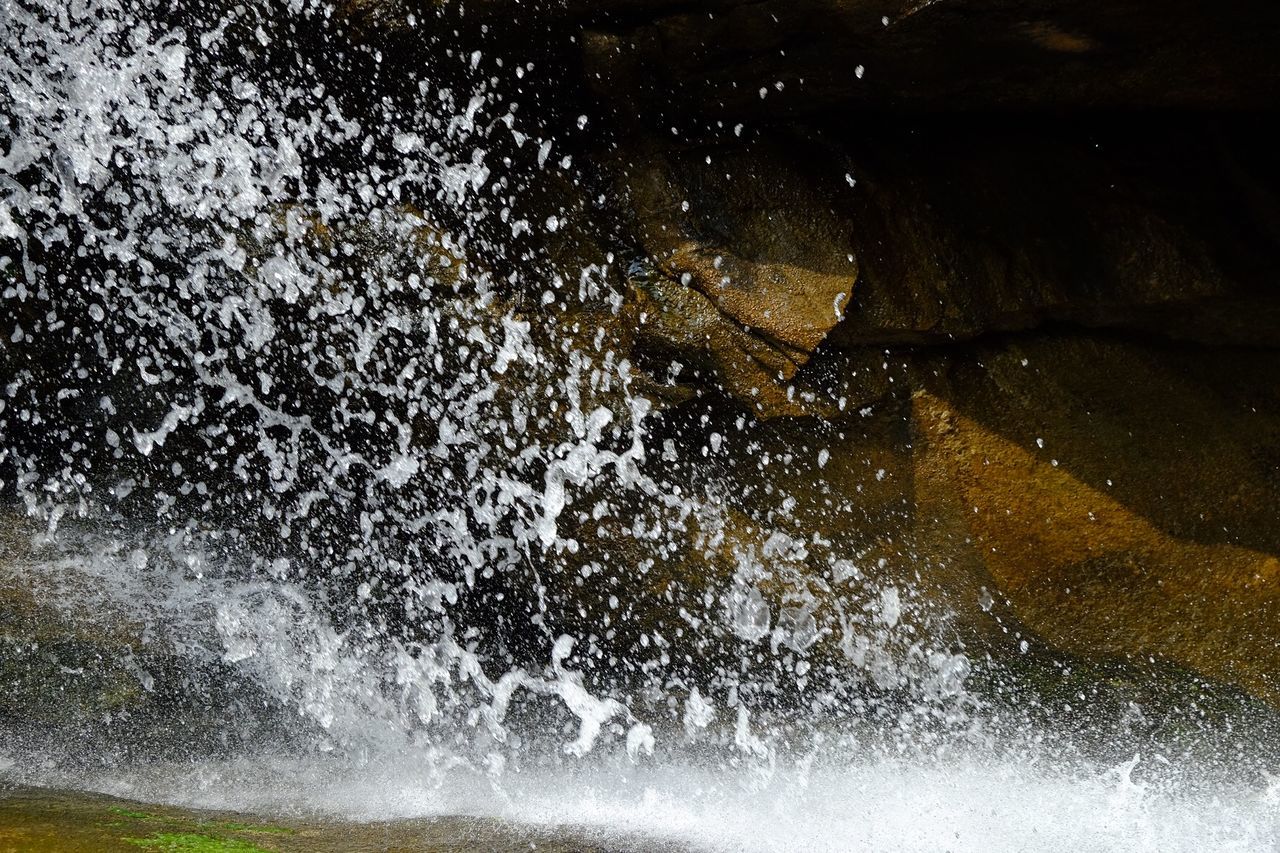 motion, water, splashing, no people, nature, beauty in nature, sea, blurred motion, day, outdoors, rock, power in nature, wave, close-up, power, long exposure, rock - object, solid, breaking, flowing water