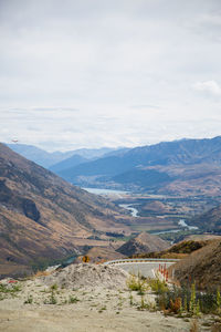 Scenic view of landscape and mountains against sky