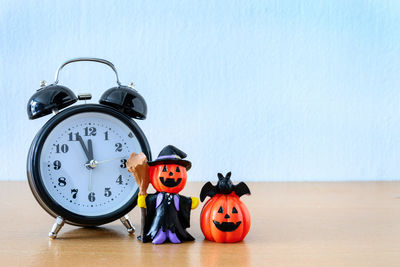 Close-up of toys on table against blue background